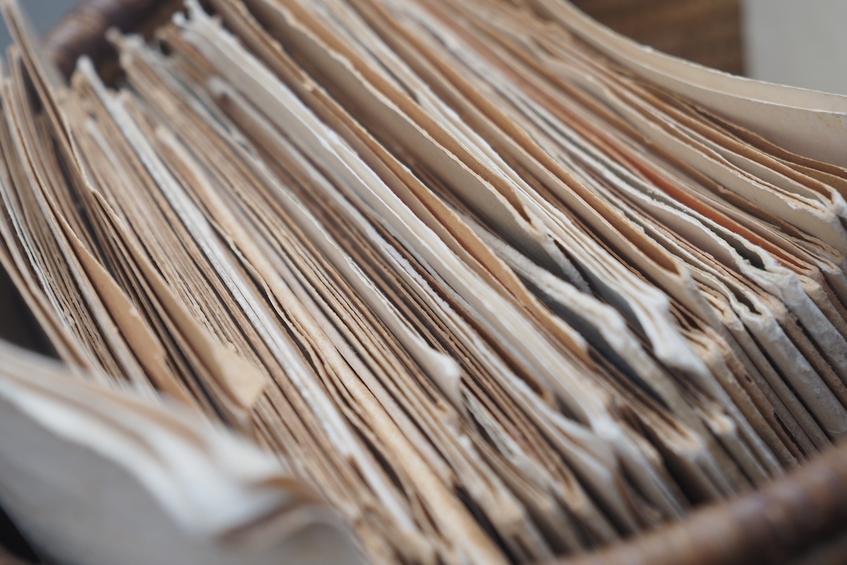 Close-up of old, worn property records and documents stored in an archive.