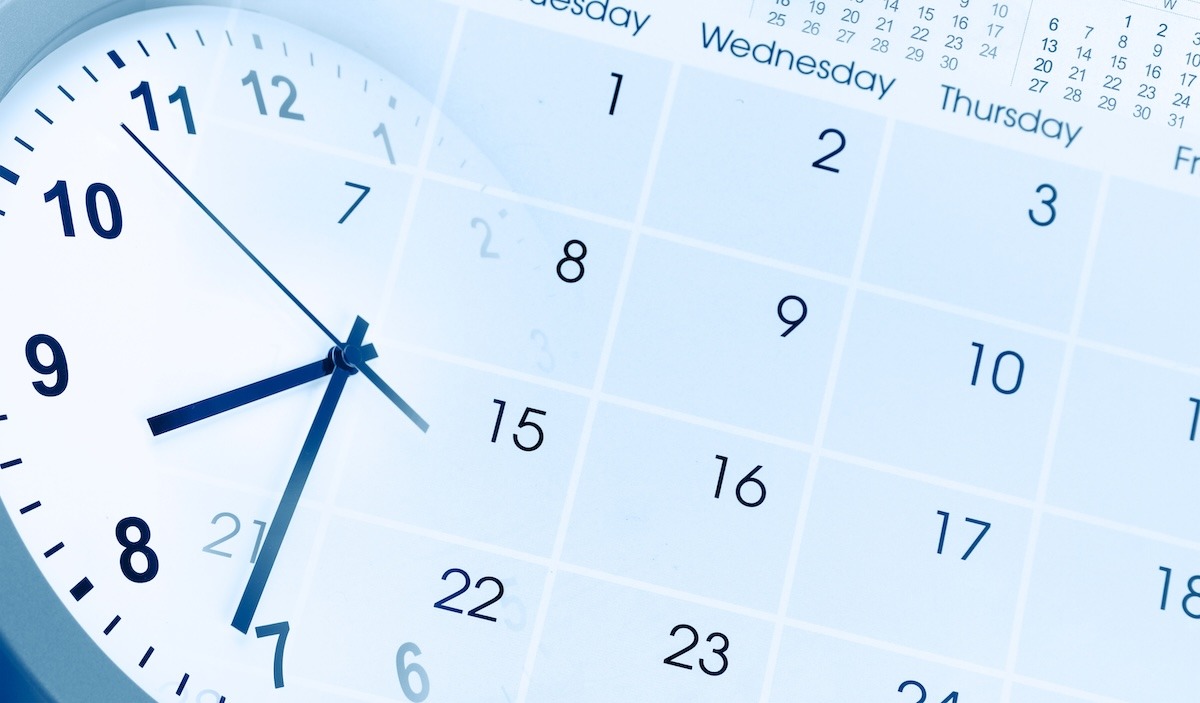 A large analog clock blended into a monthly calendar page. 